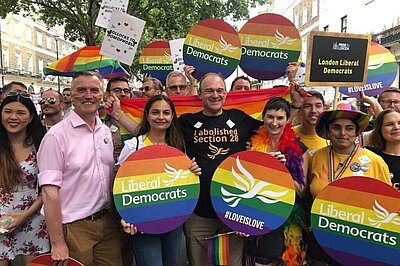 Ed Davey and campaigners at Pride in London